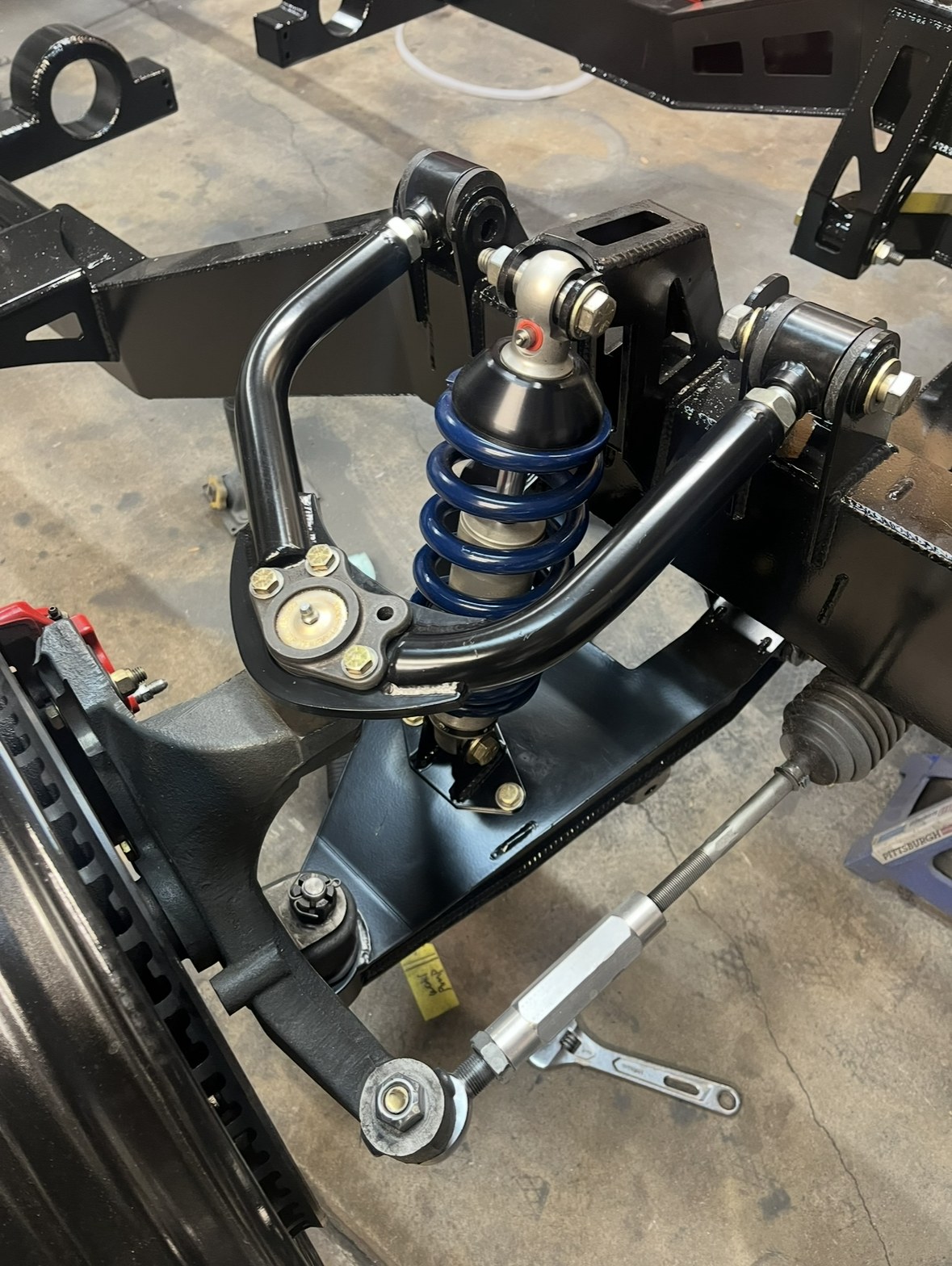 Tubular control arm and coil-over on a fabricated front crossmember