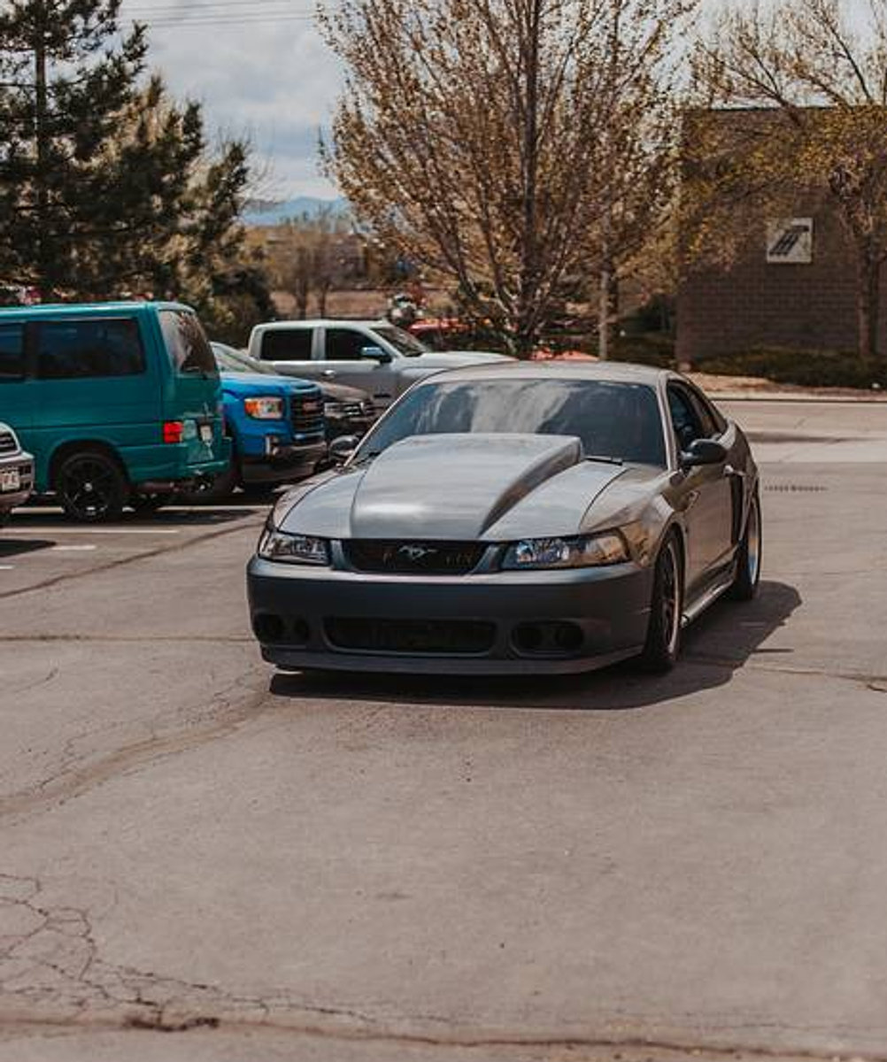Gray Mustang with a cowl hood
