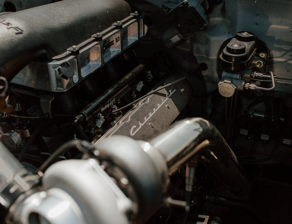 Turbocharger plumbing beside an engine