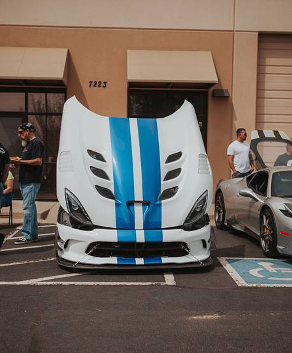 White Viper with blue stripes, hood up, outside the shop