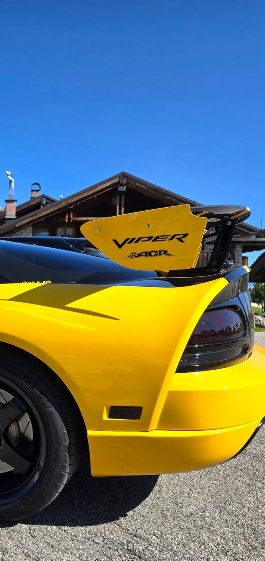 Rear corner of a yellow and black Viper ACR showing the wing